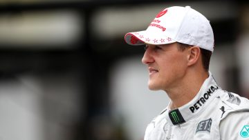 Michael Schumacher signs F1 helmet for charity auction